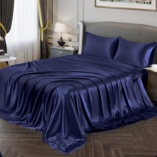 Neatly made bed with layered bedding including sheets, duvet, and pillows — Anna's Linens