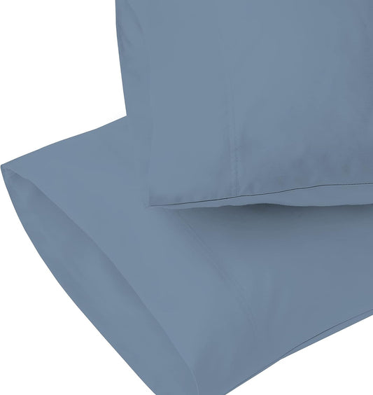 Crisp percale sheets next to smooth sateen sheets on a neatly made bed — Anna's Linens
