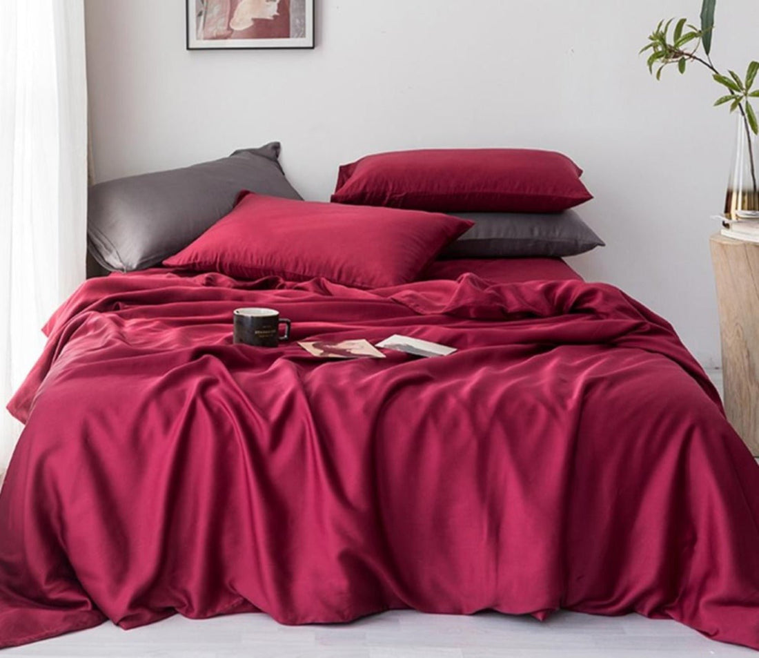 Close-up of smooth sateen cotton sheets on a luxury bed — Anna's Linens