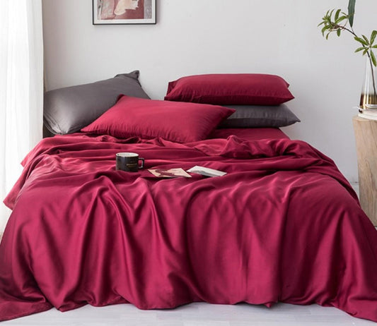 Close-up of smooth sateen cotton sheets on a luxury bed — Anna's Linens