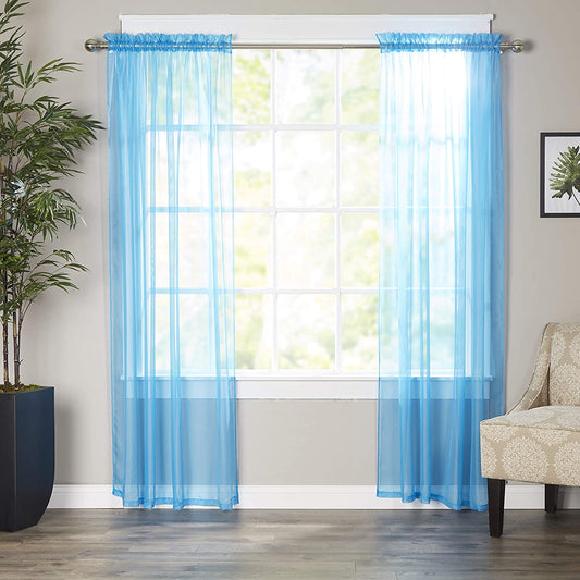 Elegant linen curtains framing a sunlit living room window — Anna's Linens