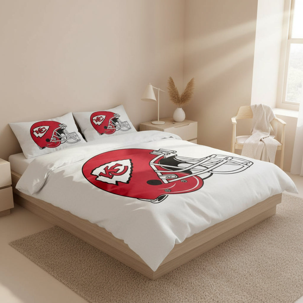 Bedding set with Kansas City Chiefs logo on a white comforter in a bedroom setting.