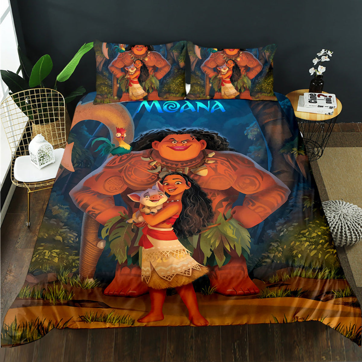 Bedding set with Moana and Maui design on a bed in a room.