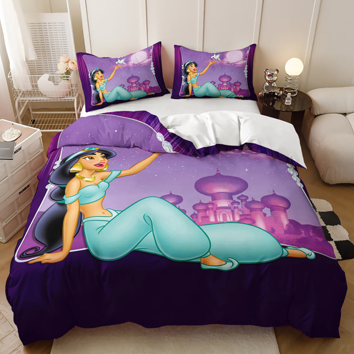 Bedding set with princess design on a bed in a room.