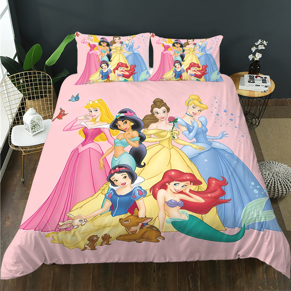 Disney princess-themed bedding set on a bed with a dark wall and plant in the background.