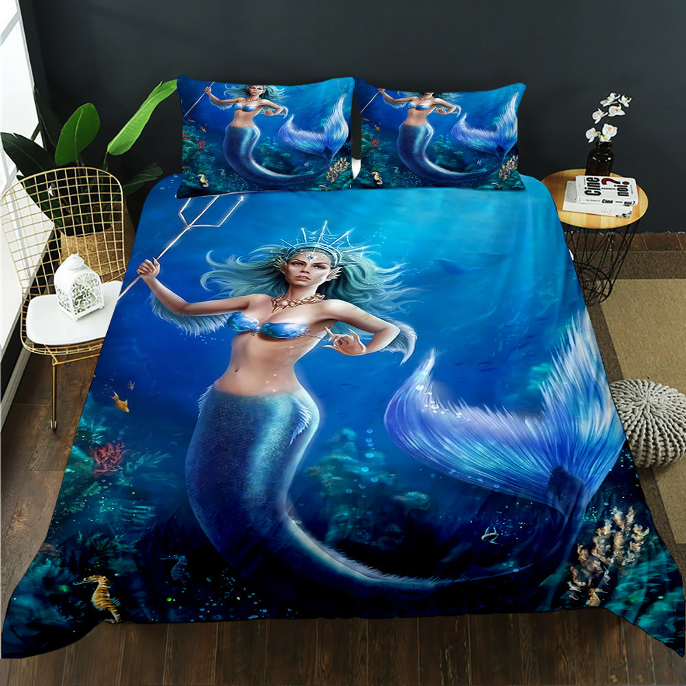 Mermaid-themed bedding set with a blue color scheme on a bed.