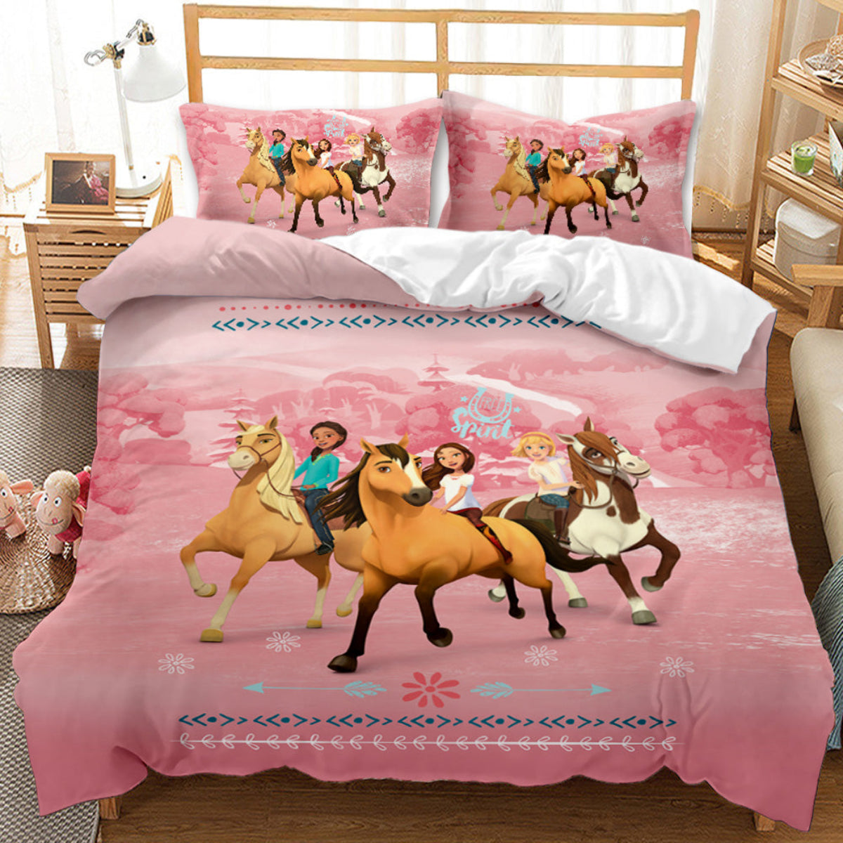 Pink bedding set with horse and rider design on a bed in a bedroom.
