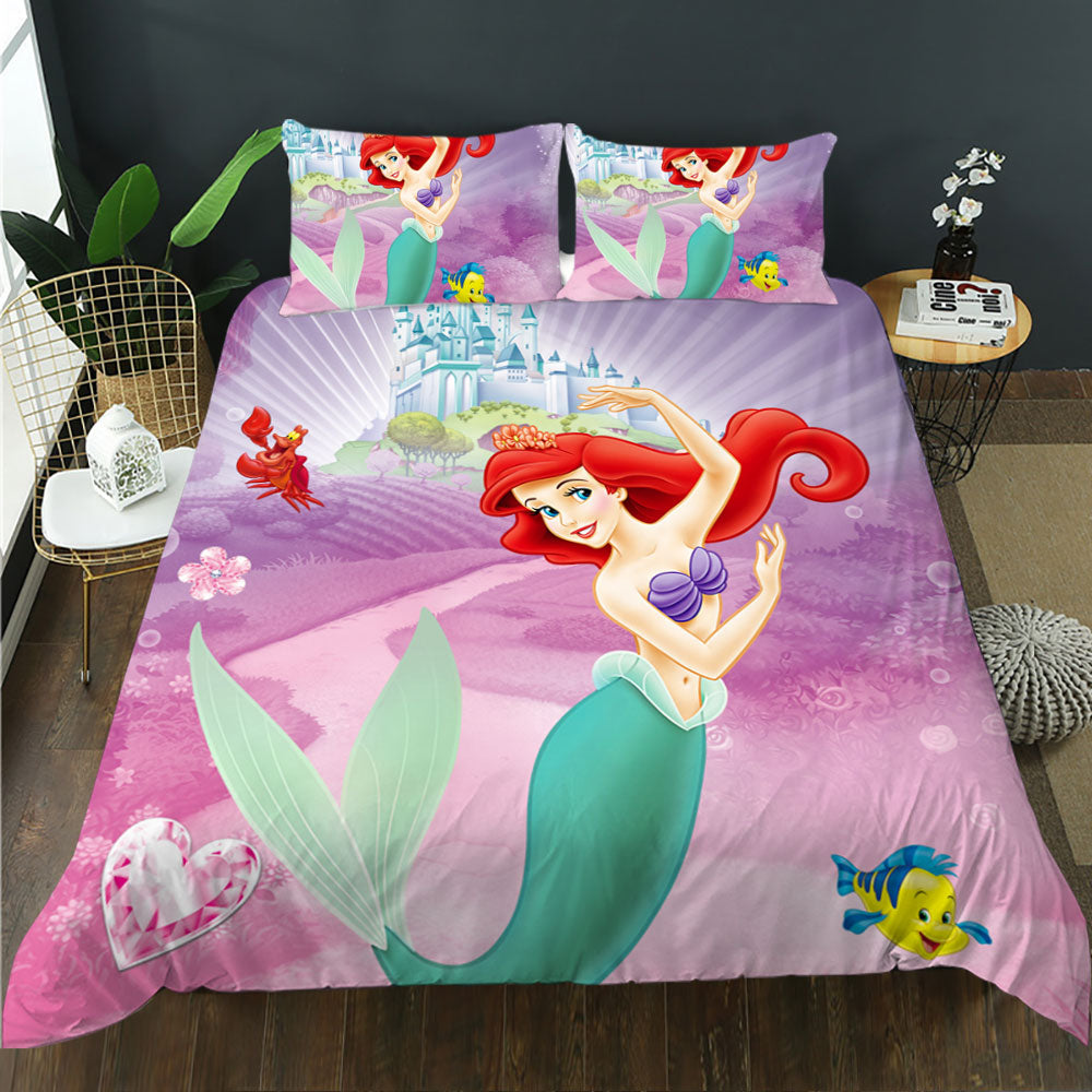 Mermaid-themed bedding set with character design on a bed in a room.