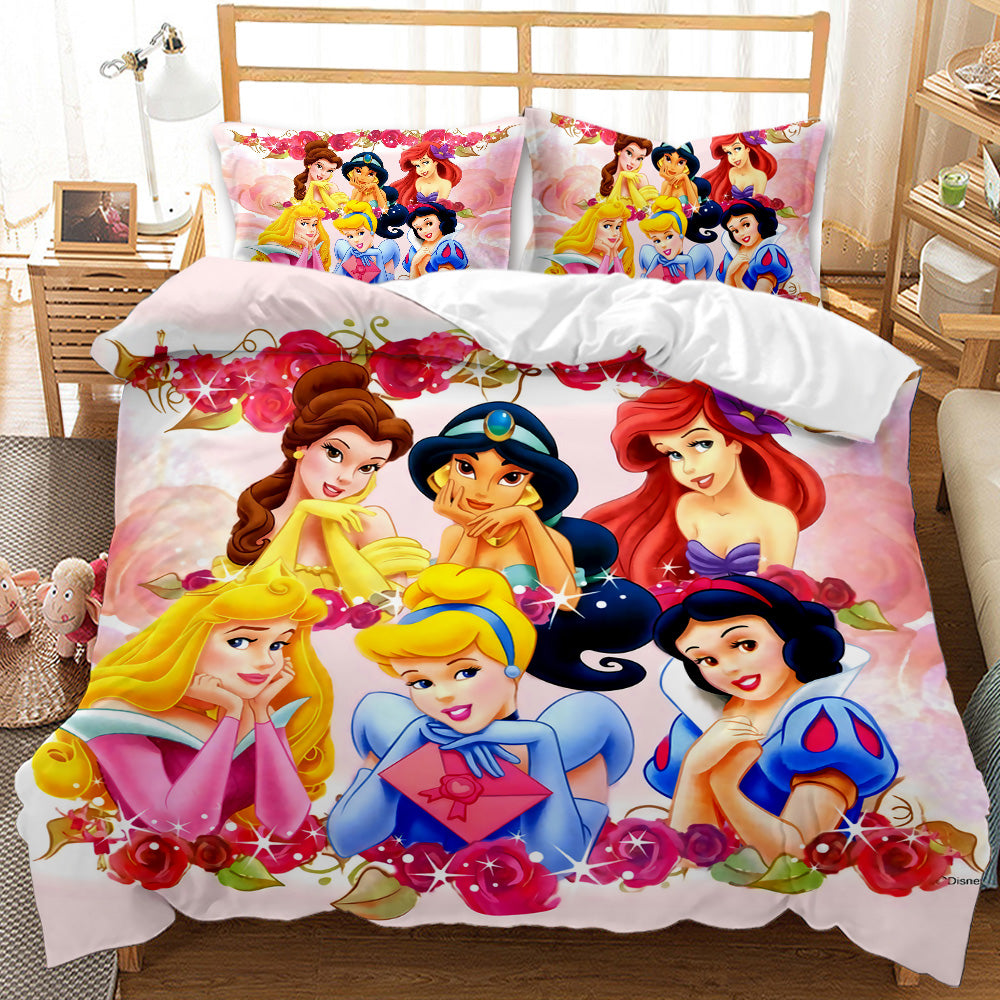 Disney princess-themed bedding set on a bed with a wooden headboard.