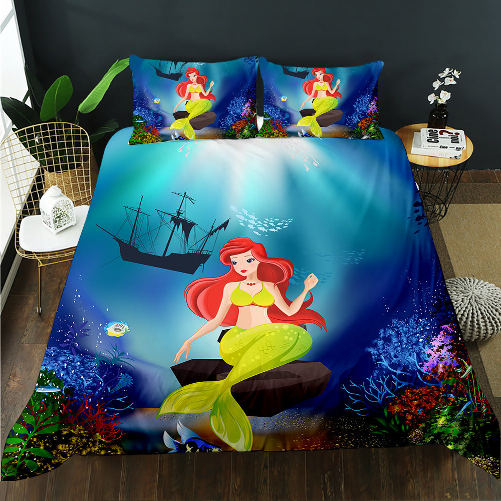 Mermaid-themed bedding set with underwater scene on a bed