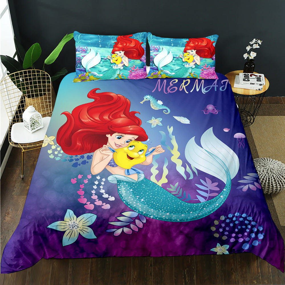 Mermaid-themed bedding set with colorful design on a bed in a room.